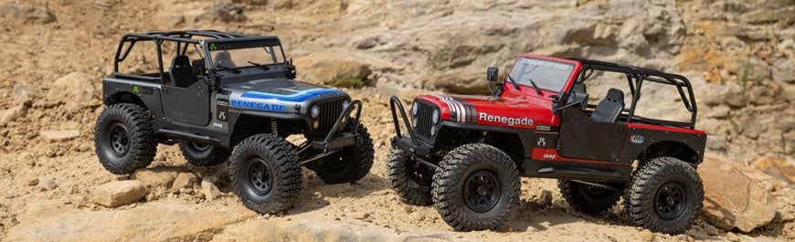 Axial SCX10 III Jeep CJ-7 Blue and Red on rocky terrain