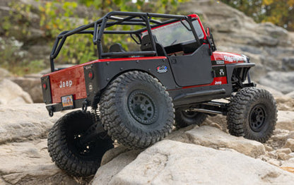 Axial SCX10 III Jeep CJ-7 Red climbing over rocks