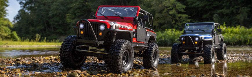 Axial SCX10 III Jeep CJ-7 Blue and Red crawlers on a trail
