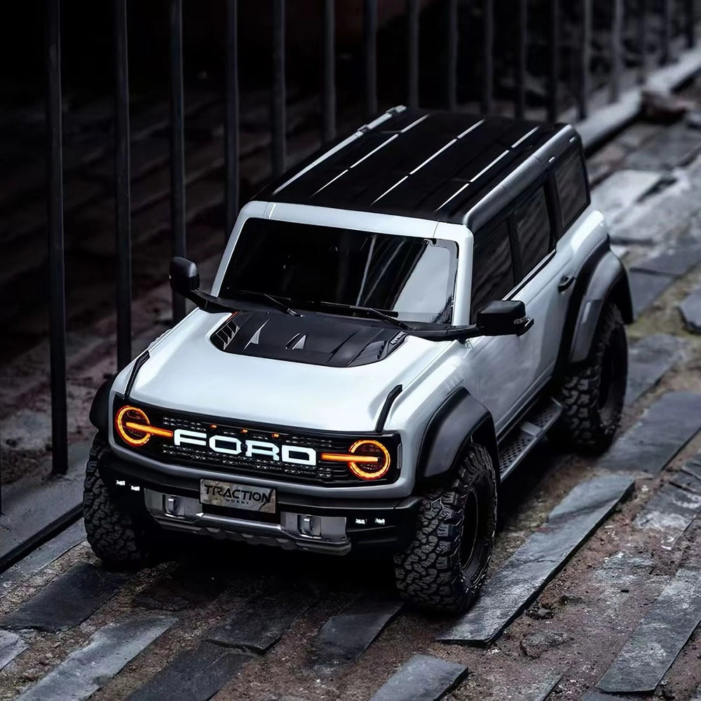 White Bronco Raptor illuminated outdoor front