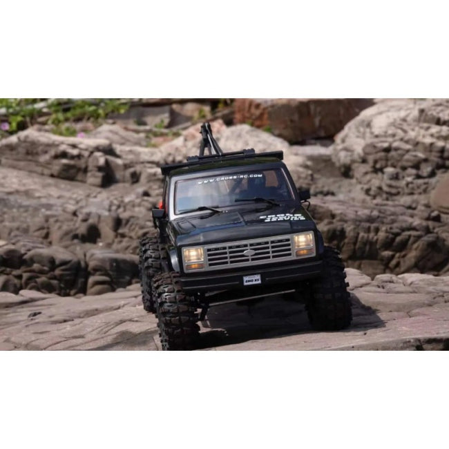 CROSSRC EMO X3 Deep Grey crawling over rocky terrain