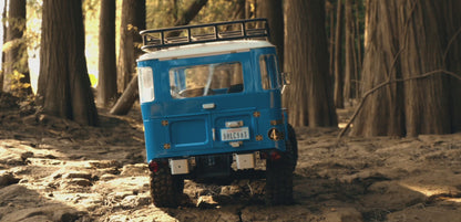 Blue FMS Toyota Land Cruiser FJ40 scale crawler rear trail view