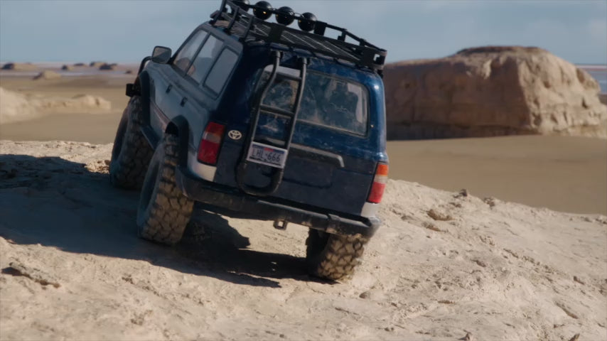 FMS FCX10 PRO Toyota LC80 RS V2 brushless crawler on desert rocks