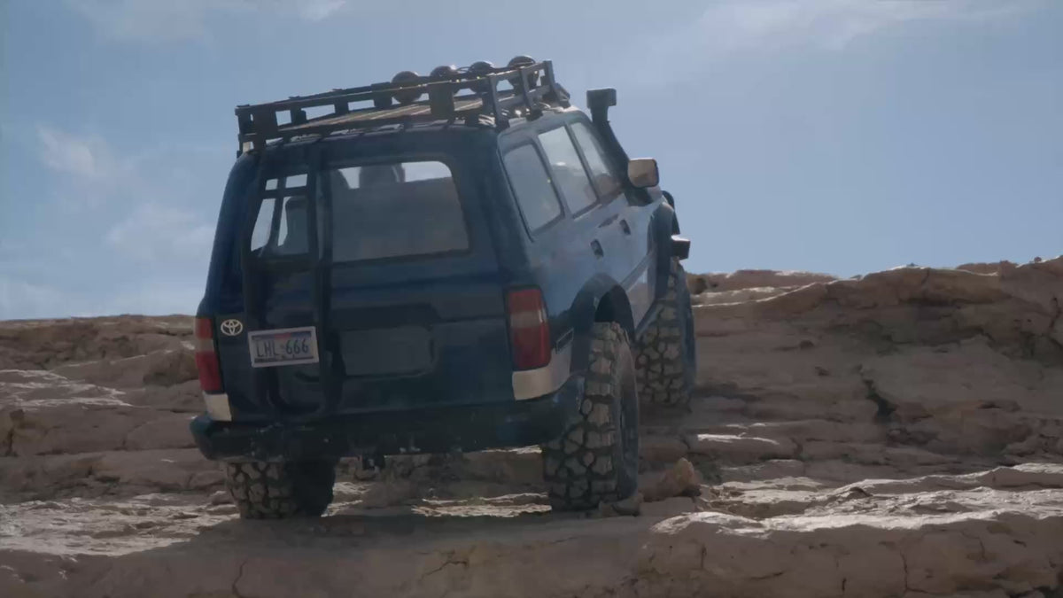 FMS FCX10 PRO Toyota LC80 RS V2 climbing across rock terrain