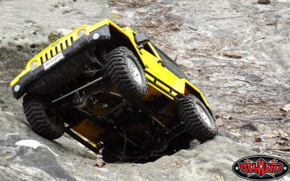 Yellow customer crawler articulation with RC4WD Prowler XS tires