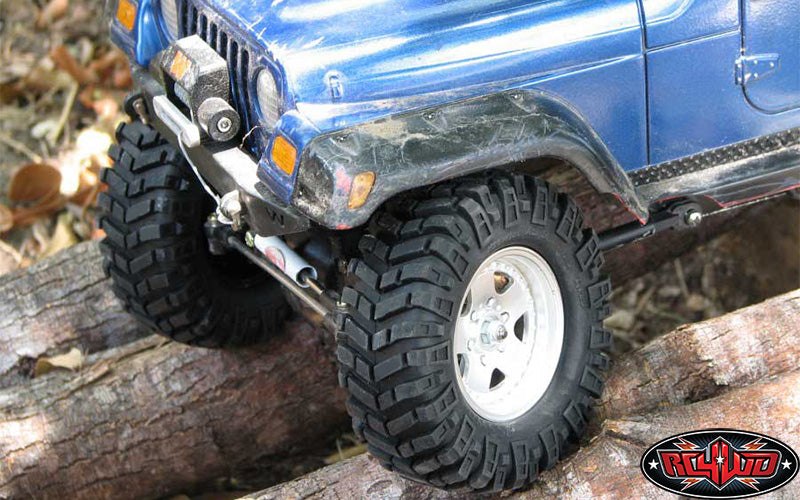 RC4WD Prowler XS tire on blue crawler crossing log
