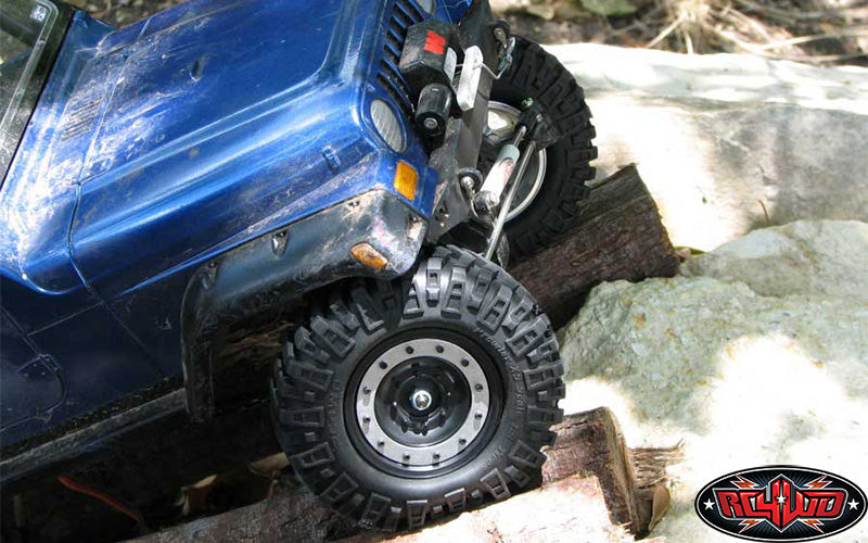 Customer blue crawler articulating on rocks with Prowler XS tires
