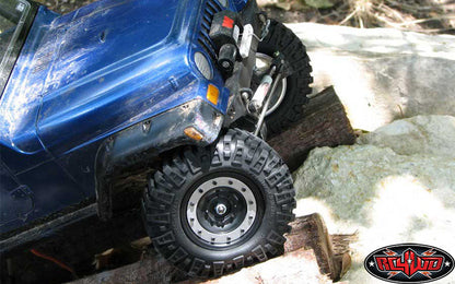 Customer blue crawler articulating on rocks with Prowler XS tires